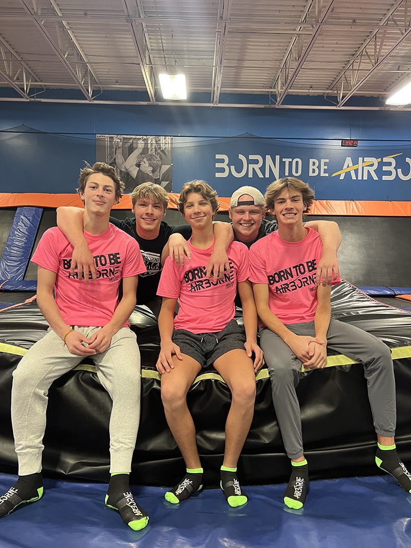 Image of youth smiling, having fun at Airborne Adventure Park.